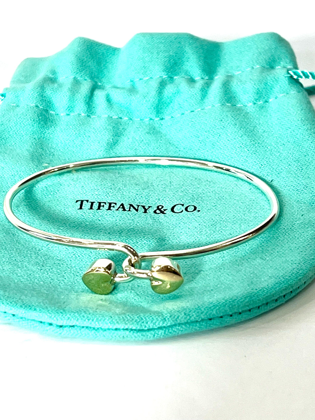 TIFFANY &amp; CO. 18K GOLD AND STERLING SILVER HEART BANGLE BRACELET