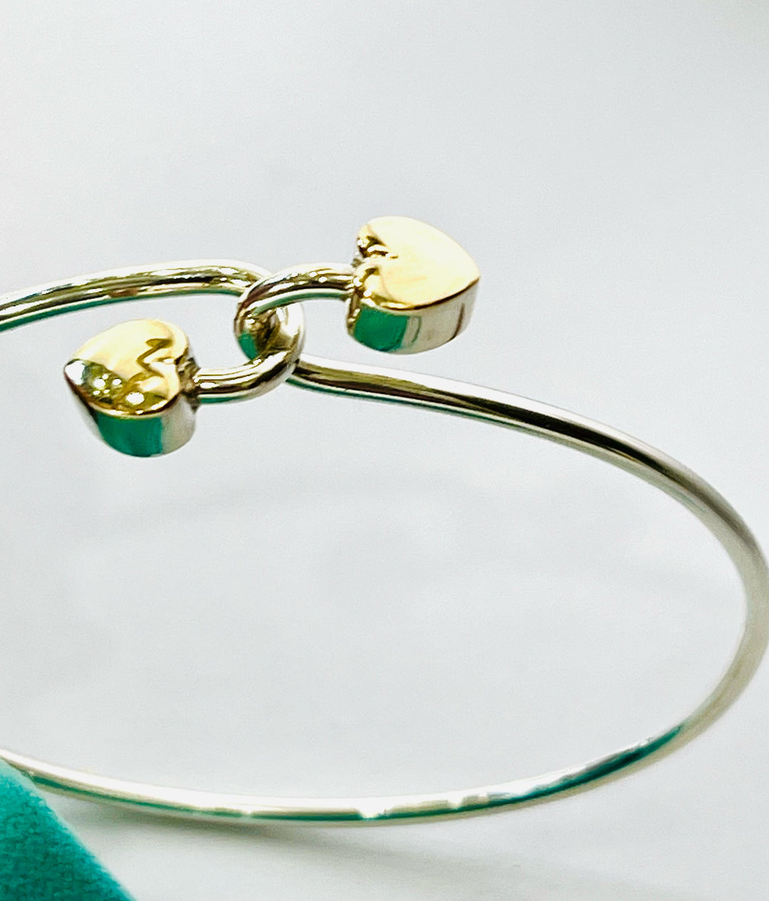 TIFFANY &amp; CO. 18K GOLD AND STERLING SILVER HEART BANGLE BRACELET