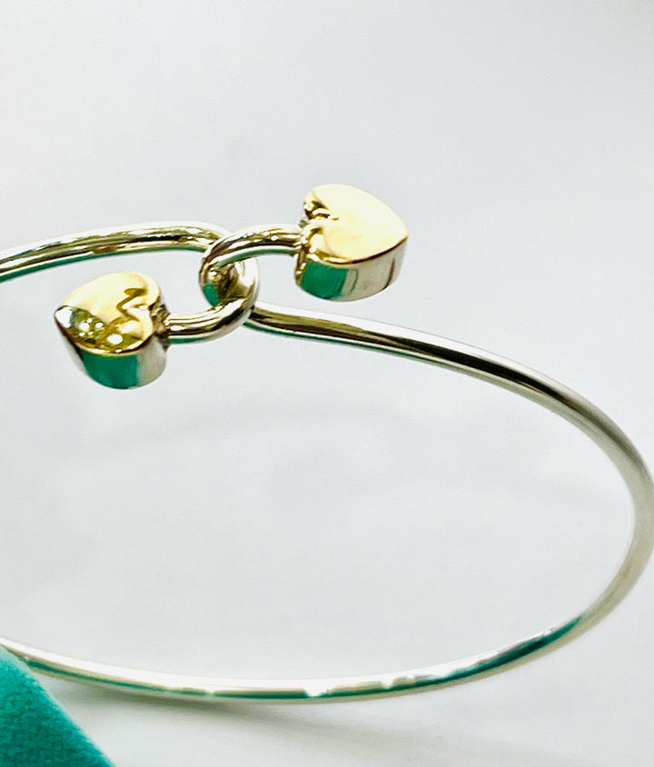 TIFFANY &amp; CO. 18K GOLD AND STERLING SILVER HEART BANGLE BRACELET