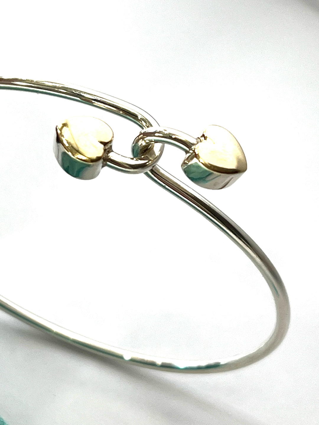 TIFFANY &amp; CO. 18K GOLD AND STERLING SILVER HEART BANGLE BRACELET
