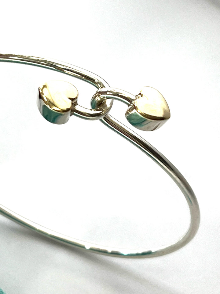 TIFFANY &amp; CO. 18K GOLD AND STERLING SILVER HEART BANGLE BRACELET