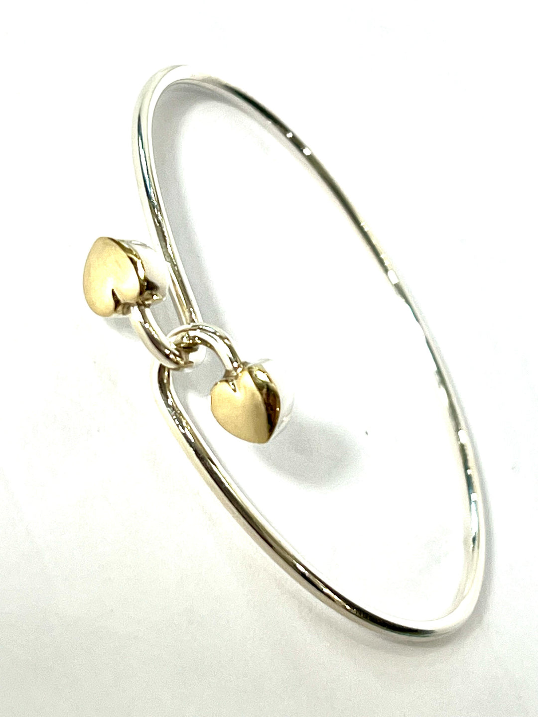 TIFFANY &amp; CO. 18K GOLD AND STERLING SILVER HEART BANGLE BRACELET