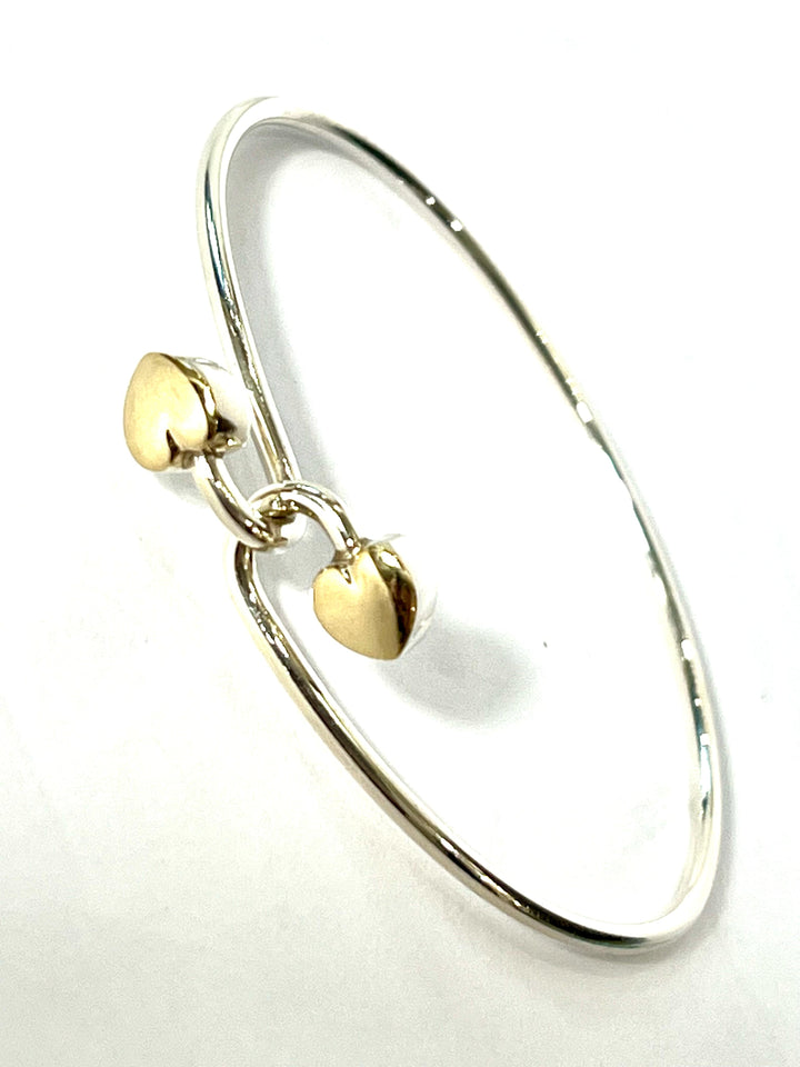 TIFFANY &amp; CO. 18K GOLD AND STERLING SILVER HEART BANGLE BRACELET