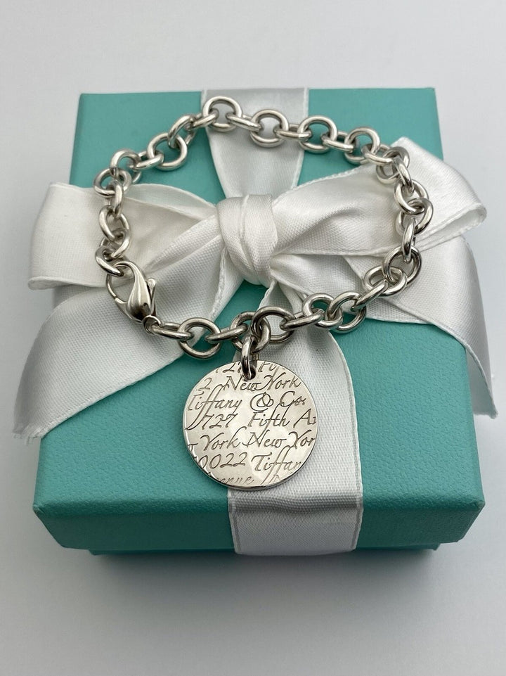 TIFFANY &amp; CO. NOTES CHARM BANGLE BRACELET