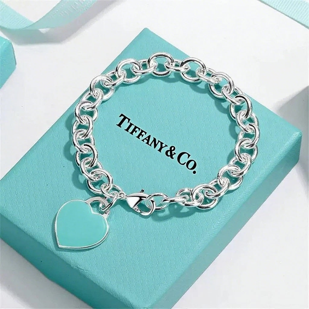 TIFFANY STERLING SILVER BLUE ENAMEL RTT HEART CHARM BRACELET