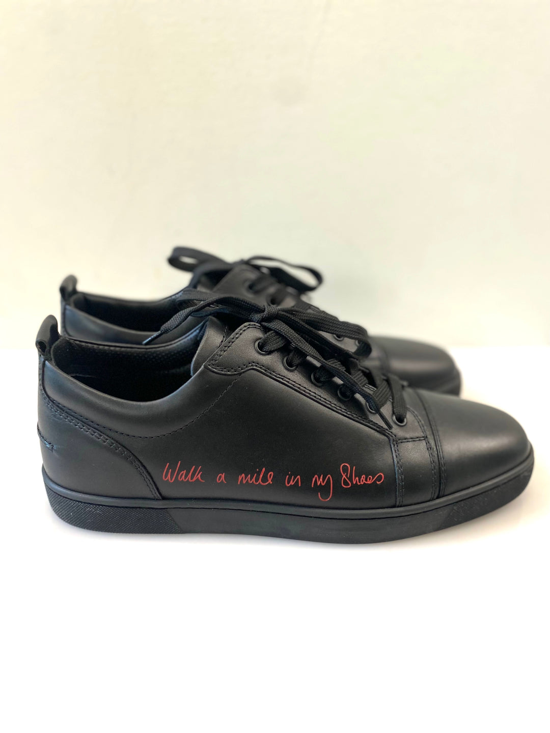 CHRISTIAN LOUBOUTIN LOUIS JUNIOR LOW "WALK A MILE IN MY SHOES" SNEAKERS