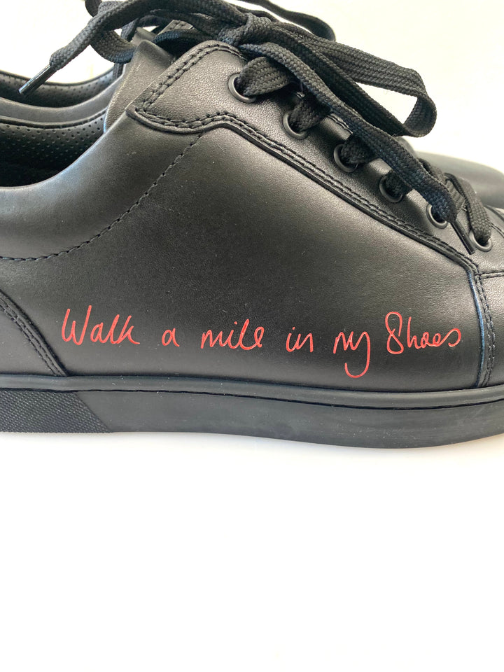 CHRISTIAN LOUBOUTIN LOUIS JUNIOR LOW "WALK A MILE IN MY SHOES" SNEAKERS