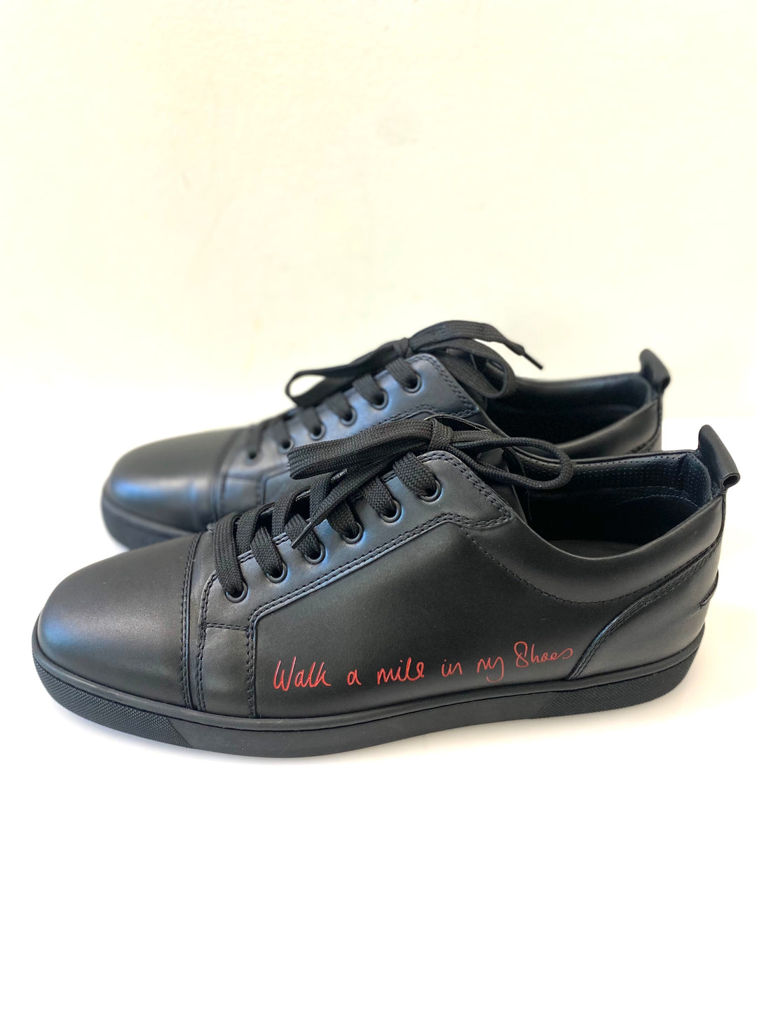 CHRISTIAN LOUBOUTIN LOUIS JUNIOR LOW "WALK A MILE IN MY SHOES" SNEAKERS