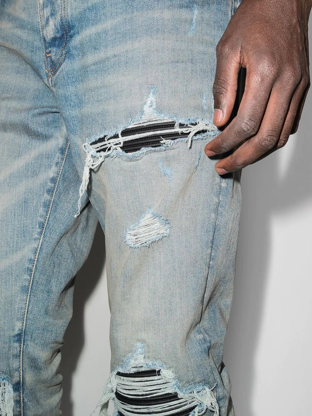 AMIRI MX1 DISTRESSED EFFECT SKINNY JEANS