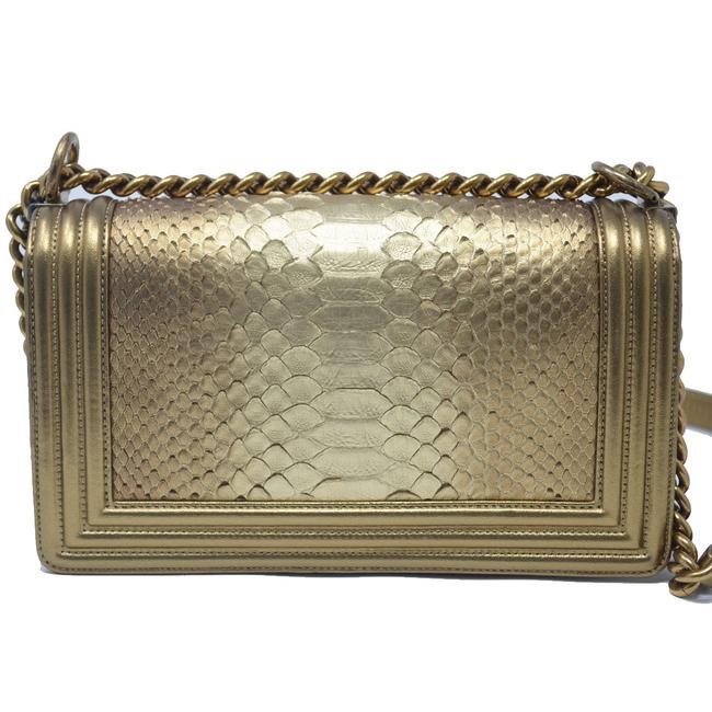 Python Metallic Leather CHANEL METALLIC GOLD PYTHON LEATHER MEDIUM BOY FLAP BAG – Caroline's ...