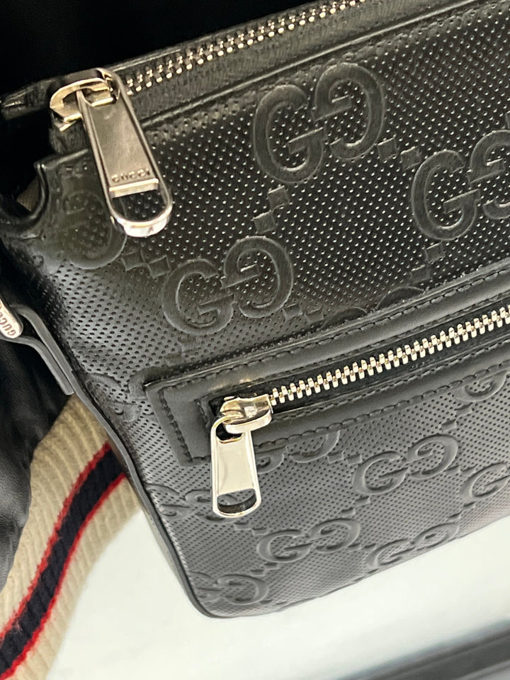 GUCCI GG EMBOSSED LEATHER SMALL MESSENGER BAG