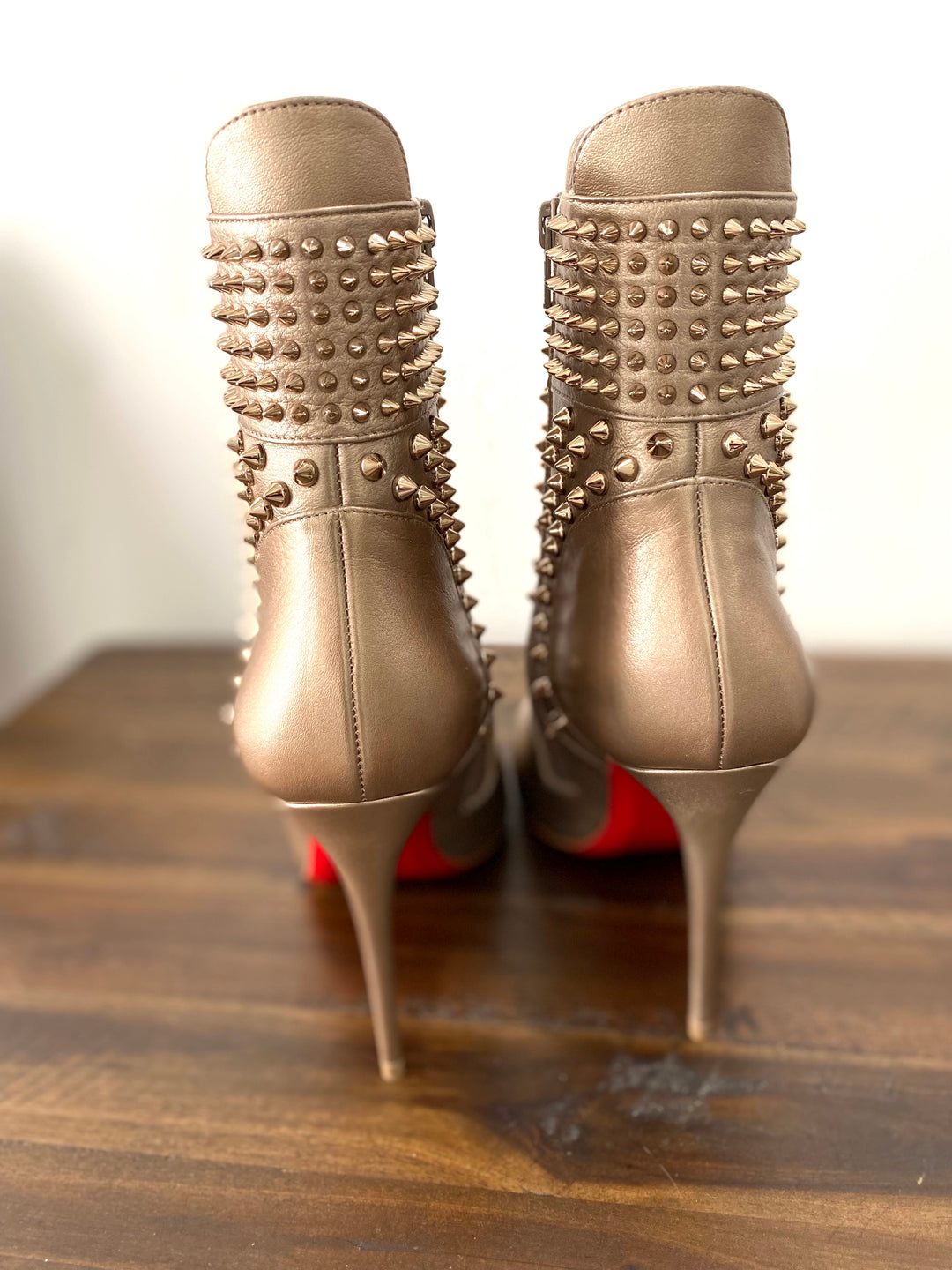 CHRISTIAN LOUBOUTIN HONGROISE SPIKED RED SOLE BOOTIES